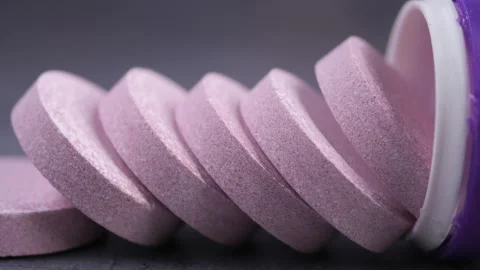 Close up motion of effervescent tablets stacked inside a container. Stock Footage 331985052