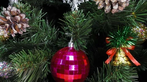 Close-up in motion green Christmas tree decorated with colorful balls Stock Footage 158738870