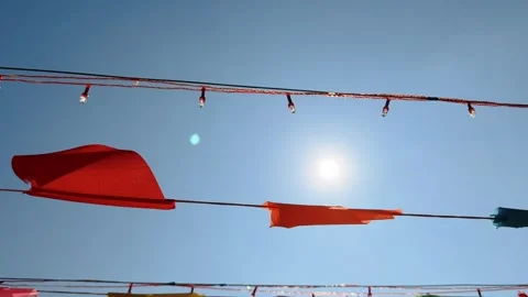Close up motion under colorful triangular bunting flags waving in the wind Stock Footage 341544321