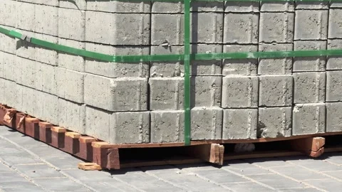 Close up motion view of stacked concrete sidewalk blocks on construction site Stock Footage 341838359