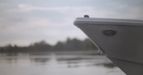 Close up of motor boat front bow as it gently floats in still water Stock Footage 120699852