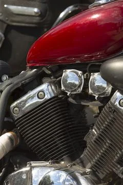 Close-up motorcycle engine and red fuel tank with chrome reflection Stock-Fotos
