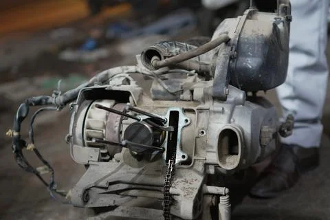 Close-Up of Motorcycle Engine During Maintenance in Workshop Environment 写真素材