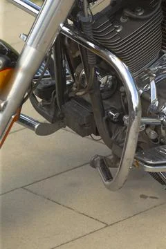 Close-up motorcycle front engine with chrome crash bar and footpeg Stock-Fotos