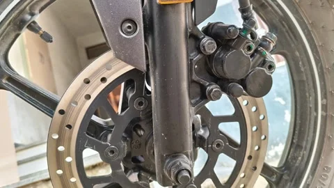 Close up of a motorcycle front hydraulic disc brake system 動画素材 328230012
