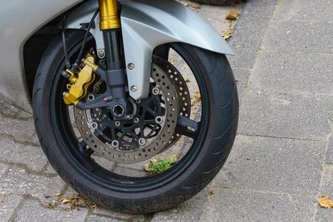 Close up of motorcycle front wheel. Stock Photos