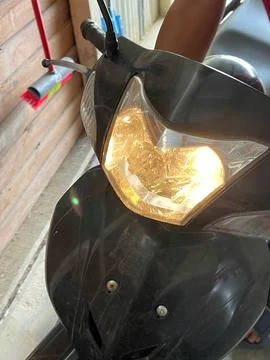 Close-Up of Motorcycle Headlight Turned On Stock Photos