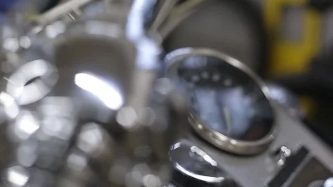 Close-up of a motorcycle speedometer and steering wheel. Sliding camera HD Stock Footage 125747811