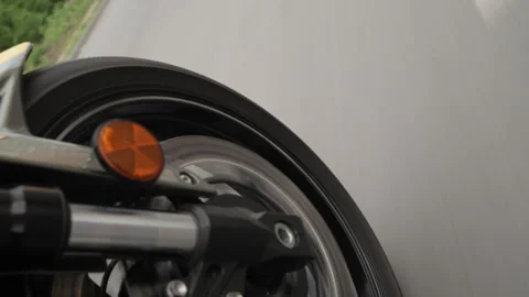 Close-Up of Motorcycle Wheel in Motion Stock Footage 274744179