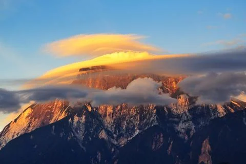 Close up of Mount Kinabalu with lenticular clouds during sunset in Kinabalu N Stock Photos