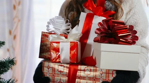 Close-up of a mountain of christmas gift boxes wrapped in colorful festive paper Video stock 118276811