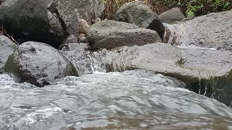 Close Up of Mountain River Flowing Over Stones Stock Footage 329883502