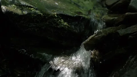 Close up of mountain stream water breaking against rocks Stock-Footage 162052313