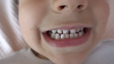 Close up mouth teeth and tongue of four ... | Stock Video | Pond5