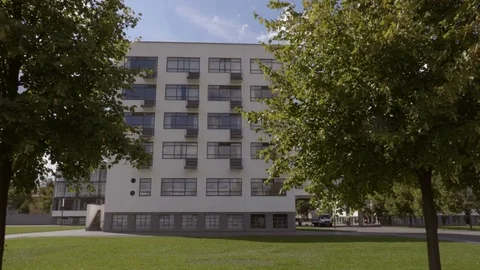 Close up move through the trees towards the Bauhaus. September 2017 Stock Footage 83633423