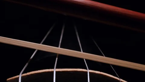 Close-up of the movement of the bow on the strings of a violin Stock-Footage 104056738