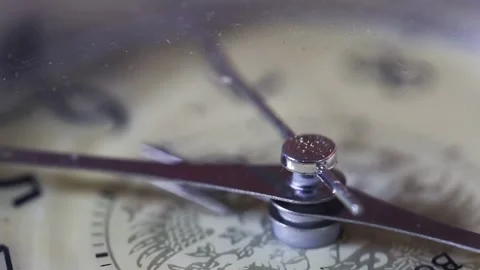 Close-up movement of magnetic compass needle seeking direction on dial face with Stock Footage 325296345