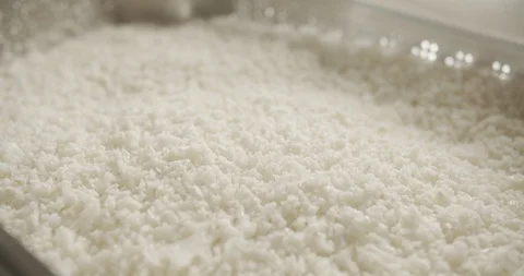 Close-up in the movement of spoon is carried out over the grainy home-made Stock Footage 123045631