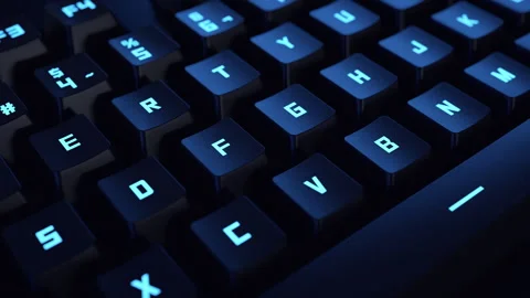 Close-up of a moving backlit mechanical gaming keyboard. Vídeos de archivo 336402512