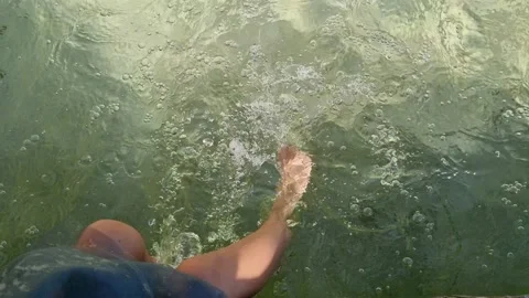 Close up of moving child legs in fresh summer water. Slow motion 4k. Stock Footage 239335723