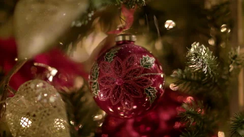 Close-up of a moving Christmas tree toy. Red glass ball painted by hand Stock Footage 205815979