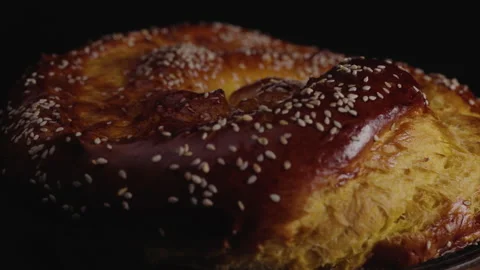 Close-up, Moving Forward, Freshly Baked Home Bread Rotates on The Turning Table Stock Footage 147867155