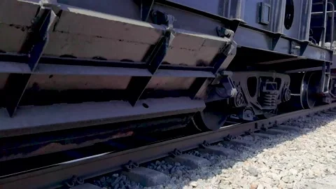 Close-up of moving freight train wheels Stock Footage 196369014