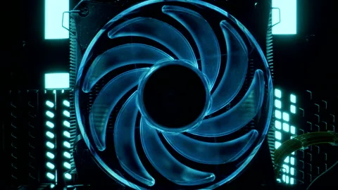 Close-up moving macro shot of blue spinning glowing cooler in gaming computer Stockbeeldmateriaal 205044621