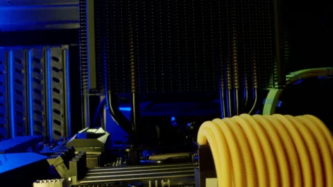 Close-up moving macro shot of the heatsink on the motherboard in gaming computer Stock Footage 202653576