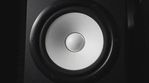 Close up of moving modern sub-woofer on recording studio. White round audio Video stock 329162191