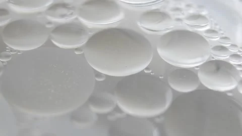 Close up of moving oil on water surface Stock Footage 294970545