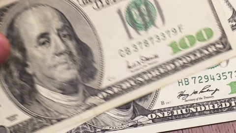 Close-up moving us dollar bills Stock Footage 223571405