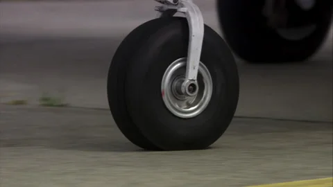Close up of moving wheels of a private jet Stock Footage 130281622