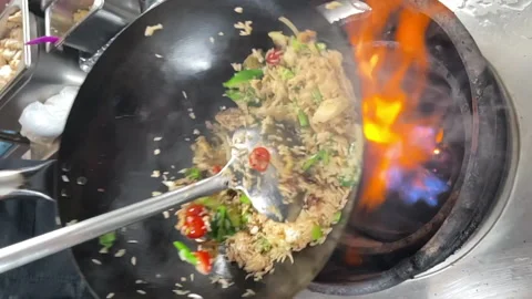 Close up of moving wok with Thai fried rice Stock Footage 169793877