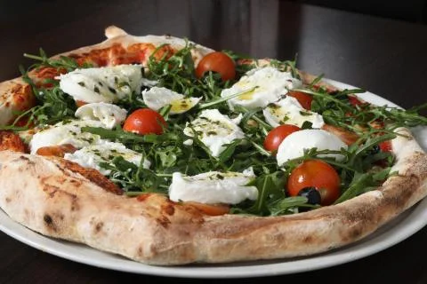 Close up on mozzarella cherry tomato pizzza Stock Photos