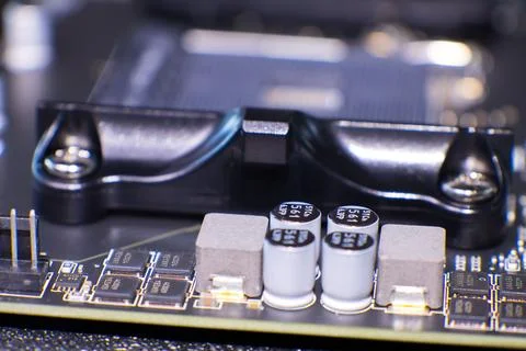 Close-up of msi computer motherboard components with capacitors and so Stock Photos
