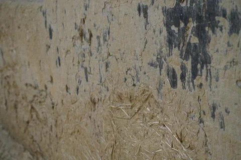Close up of a mud and straw wall texture in a rural Bangladesh insect farming fa Stock Photos