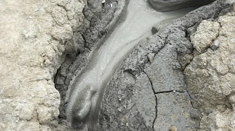 Close up on mud flowing 4K Stock Footage 68058907