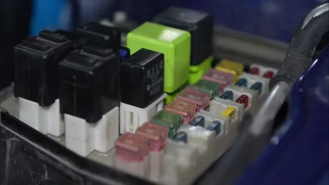 Close-up of multi colored fuses and relays inside fuse box. Stock-Footage 345913633