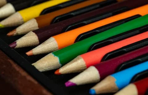Close-up of multi colored pencils or wooden crayons to each other arranged .. Foto stock