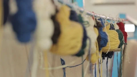 Close-up of multi-colored skeins of thread designed for weaving carpets. Stock Footage 121854880
