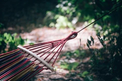 Close-up of a multi-colored striped hammock on a blurred background of an aut Stock Photos