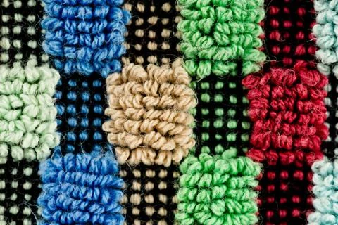 Close-up of a multi coloured detailed structured fabric pattern Stock Photos