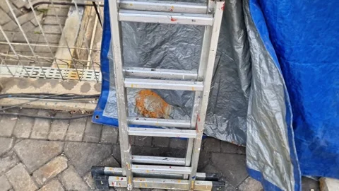 Close-up of a multi-purpose aluminum folding ladder with hinges 스톡 동영상 348341488