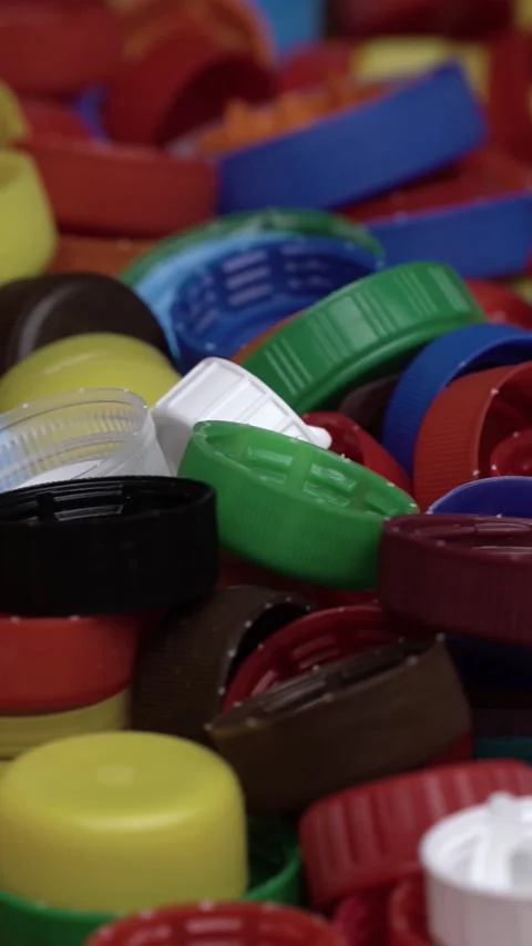 Close-up of multicolored bottle lids and caps forming a bright abstract texture  Stock Footage 341530500
