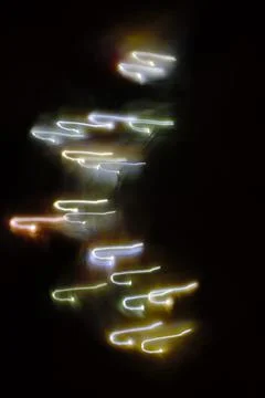 Close-up multicolored lights on dark background, christmas mood, new year Stock Photos
