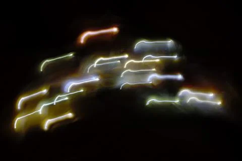 Close-up multicolored lights on dark background, christmas mood, new year Stock Photos
