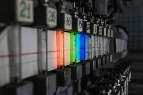 Close-up of multicolored rotameters in a dark technical room. Rotameters in t Stock-Fotos