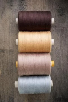 Close-up of multicolored sewing thread spools Фото