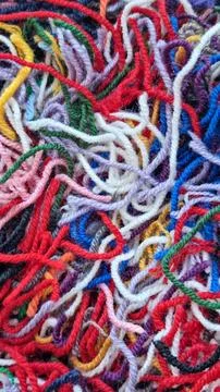 Close-up of multicolored of a tangle yarn scraps and thread cuttings Stock Photos